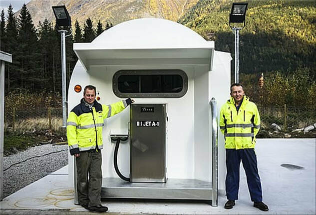 Photo of Fuel Proof founders Andrew Hargreaves and Roger Pilkington standing in front of a Fuel Proof aviation fuel tank installation